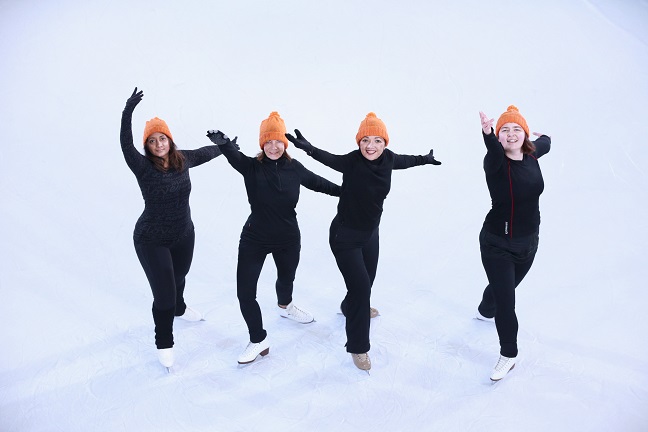 Synchronised skaters perform for Woolly Hat Day.jpg